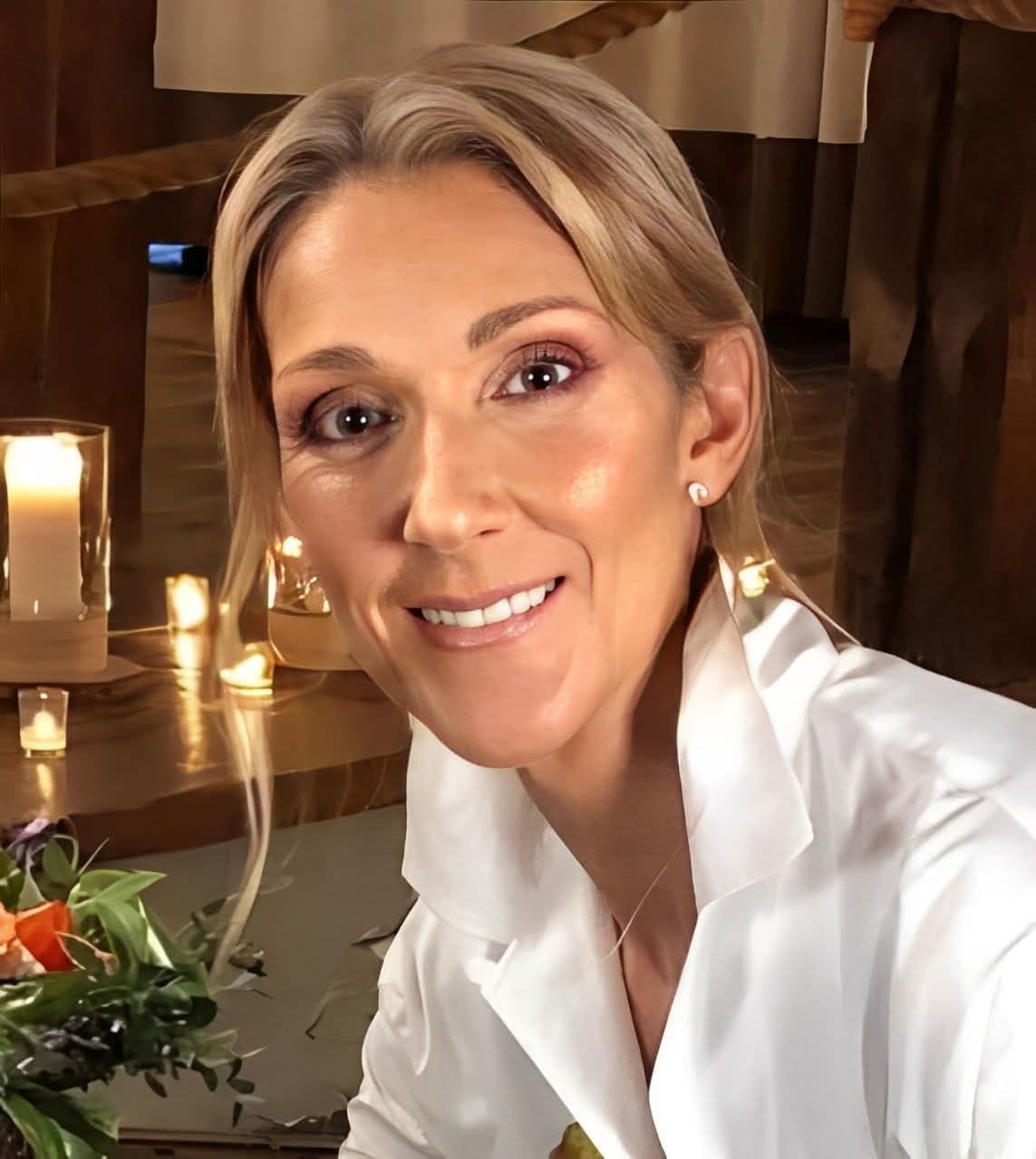 Celine Dion in a quiet, candlelit moment — warmth and presence